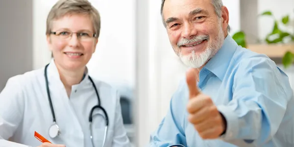 A man giving the thumbs up next to a woman.