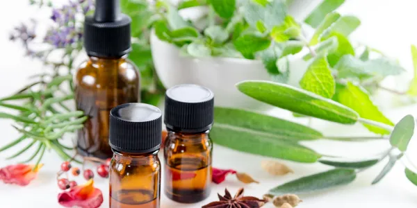 A close up of three bottles with oils