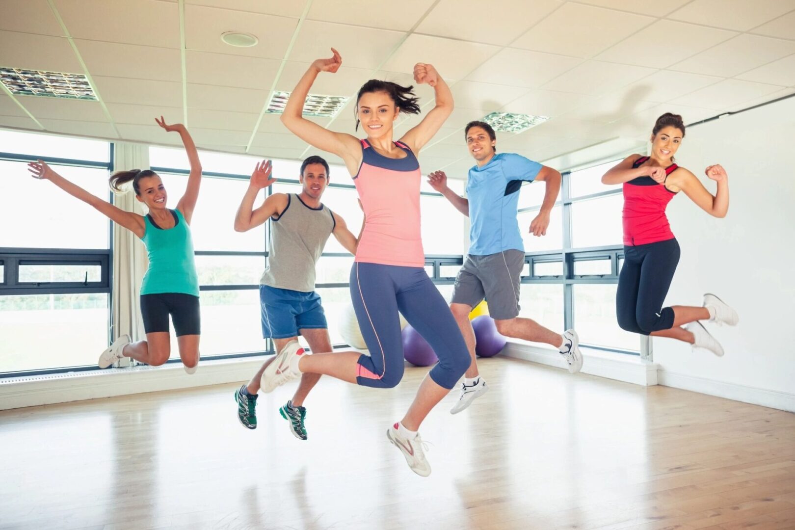 A group of people jumping in the air.