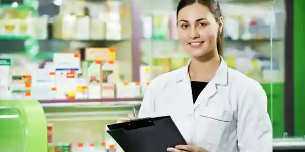 A woman in white lab coat holding a clipboard.