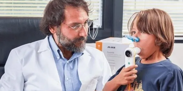 A man and woman looking at something on the phone.